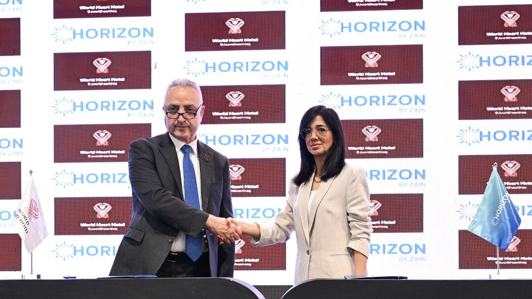 Horizon and World Heart Hotel representatives shaking hands after signing the MoU at ITEX Iraq 2026